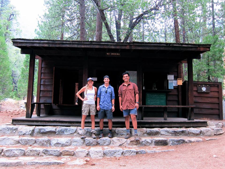 Girl and two guys after finishing the Rae Lakes Loop trail in front of the Ranger station 