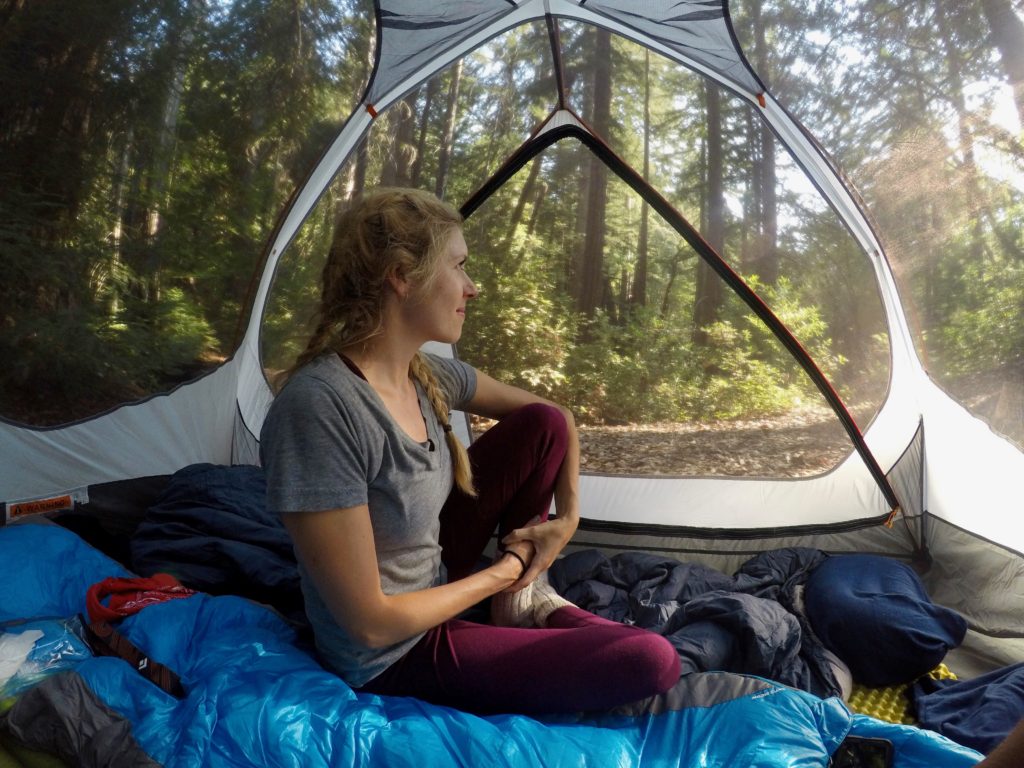 Girl in tent in Big Sur, CA