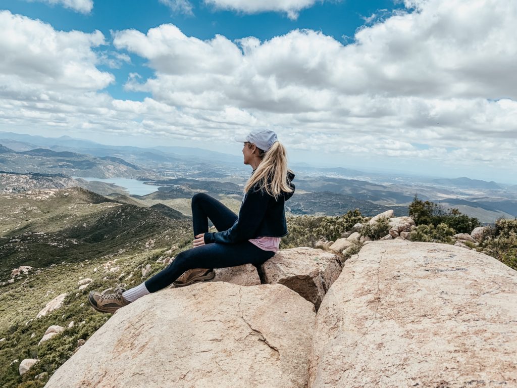 Girl on top of rock at a San Diego hike in Poway